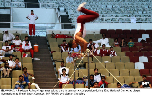 a pakistan railways gymnast takes part in the gymnastic competition during the 32nd national games at the liaquat gymnasium at the jinnah sports complex on saturday photo inp a pakistan railways gymnast takes part in the gymnastic competition during the 32nd national games at the liaquat gymnasium at the jinnah sports complex on saturday photo inp