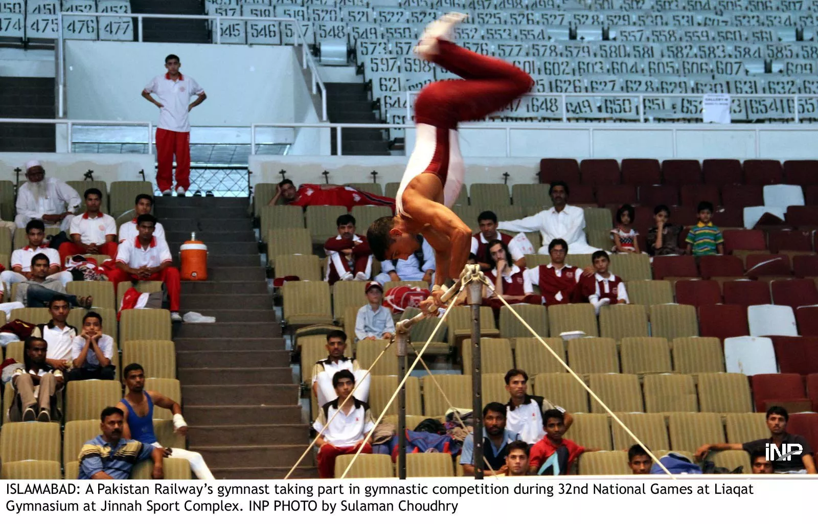 a pakistan railways gymnast takes part in the gymnastic competition during the 32nd national games at the liaquat gymnasium at the jinnah sports complex on saturday photo inp a pakistan railways gymnast takes part in the gymnastic competition during the 32nd national games at the liaquat gymnasium at the jinnah sports complex on saturday photo inp