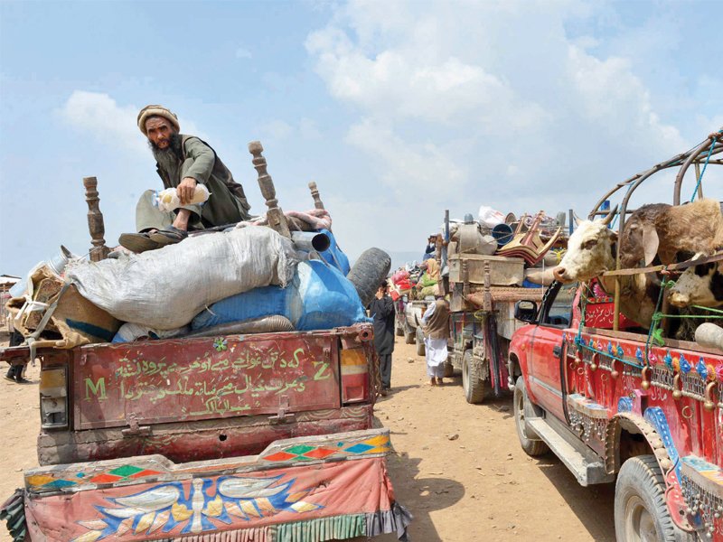 residents of para chamkani start the slow journey home after security forces cleared the area of militants in an operation which lasted 34 days photo afp
