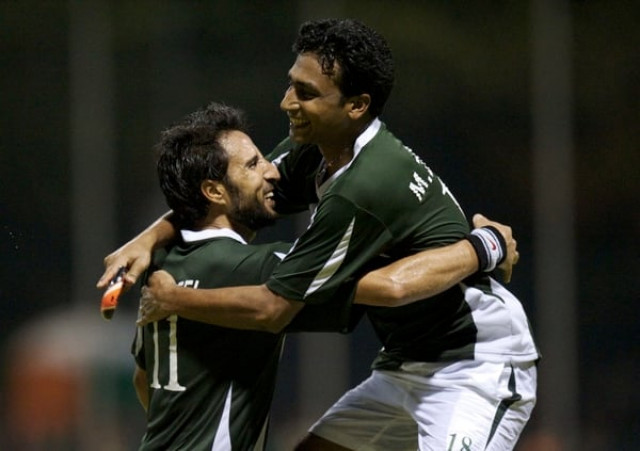 pakistani players celebrate after scoring a goal against south africa in their world hockey league group match photo fih