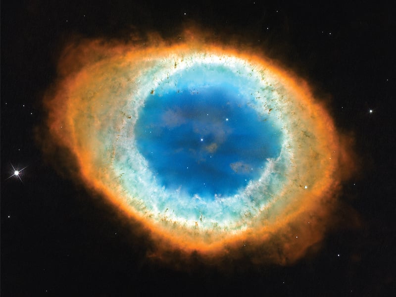 the ring nebula as captured by the hubble space telescope the whole structure in the photograph is about one light year across source nasa esa and the hubble heritage stsci aura  esa hubble collaboration