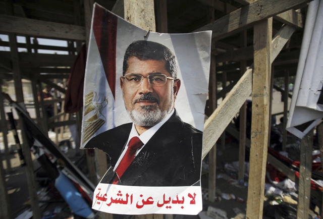 a poster of egypt 039 s president mohamed morsi saying quot no substitute for the legitimacy quot photo reuters