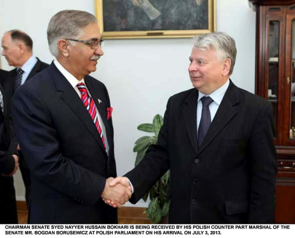 senate chairman nayyer bokhari shakes hands with his polish counterpart bogdan borusewicz at the polish parliament photo pid