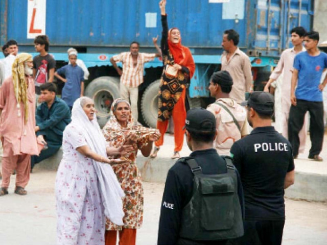 several women took part in the protest against what they called was the government s apathy to their problems a policeman aims his gun at the protesters marching towards cm house photo express online several women took part in the protest against what they called was the government s apathy to their problems a policeman aims his gun at the protesters marching towards cm house photo express online