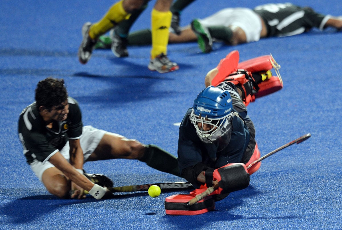 a file photo shows malaysia 039 s goalkeeper kumar subramaniam r diving to avert a goal effort by pakistan 039 s muhammad rizwan during a match from the sultan azlan shah cup men 039 s field hockey tournament photo afp file