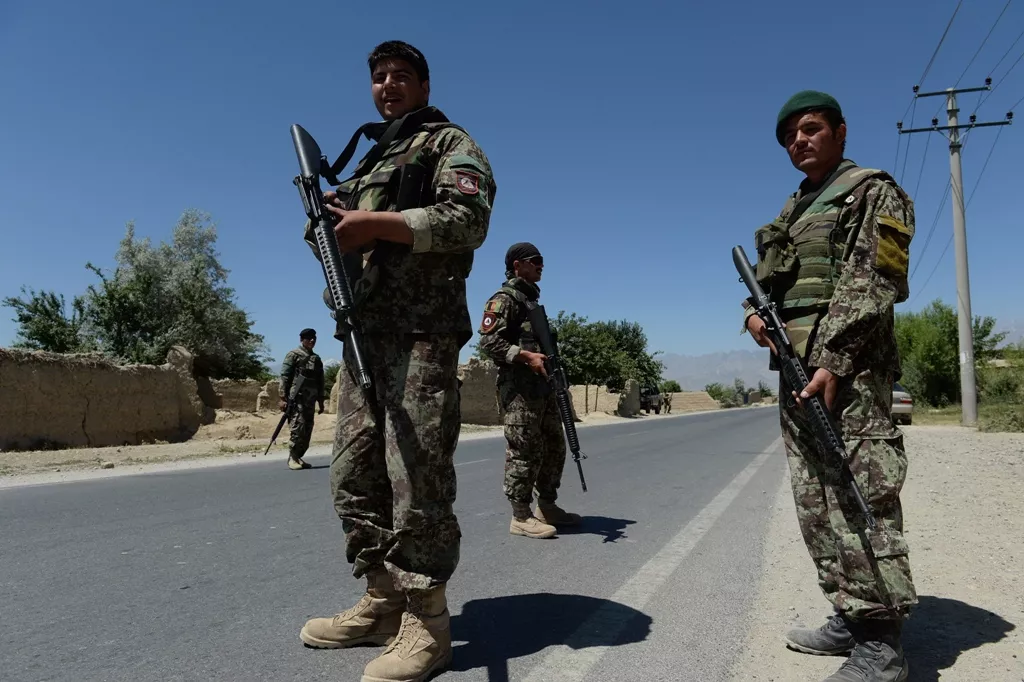 afghan national army ana soldiers stand guard outside bagram military base 50 kms north of kabul on june 19 2013 photo afp afghan national army ana soldiers stand guard outside bagram military base 50 kms north of kabul on june 19 2013 photo afp