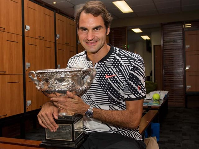 roger federer celebrating with the championship trophy inside the locker room after his victory against spain s rafael nadal in the men s singles final on day 14 of the australian open tennis tournament in melbourne on january 29 2017 photo afp roger federer celebrating with the championship trophy inside the locker room after his victory against spain s rafael nadal in the men s singles final on day 14 of the australian open tennis tournament in melbourne on january 29 2017 photo afp