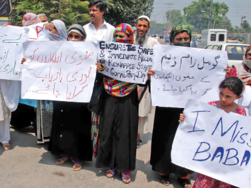 families of the eight abducted gomal zam dam employees protest outside the peshawar press club kidnappers recently released a video which threatened to kill the abductees one by one if ransom was not paid photo muhammad iqbal express