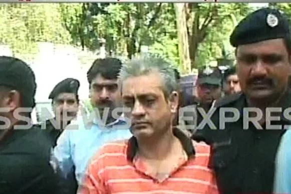 screenshot showing tauqir sadiq being taken to the court screenshot showing tauqir sadiq being taken to the court