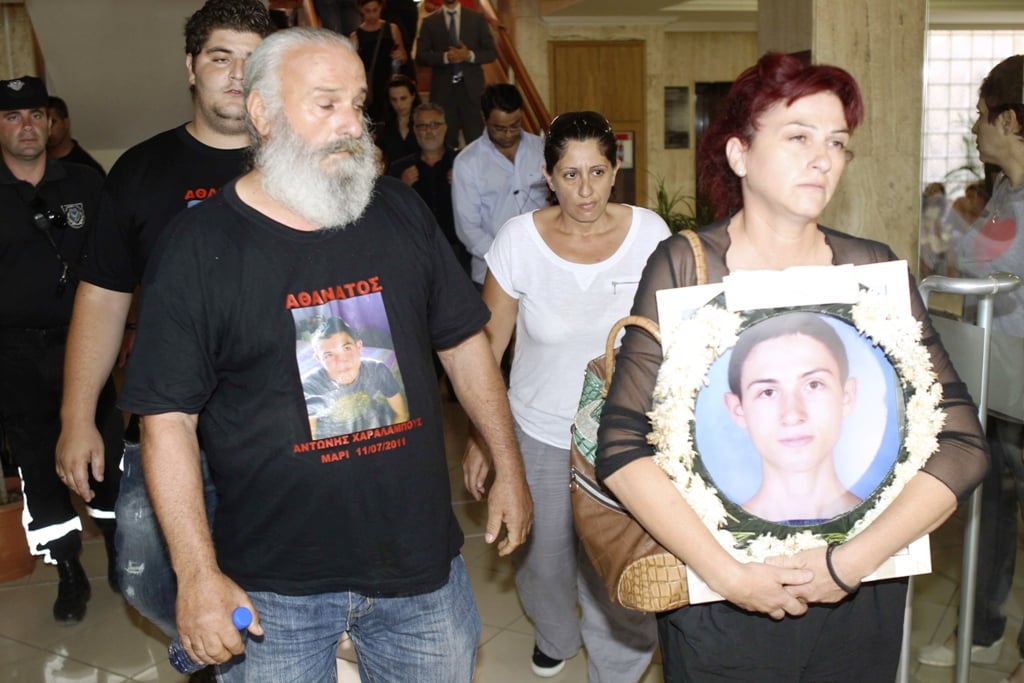 relatives of victims of a munitions explosion in cyprus in 2011 emerge from a courthouse in the coastal town of larnaca july 9 2013 photo reuters