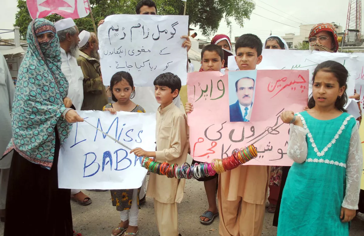 holding a placard inscribed with i miss baba khush bakht stood outside the peshawar press club and lamented the government is not taking steps to recover the kidnapped workers photo ppi holding a placard inscribed with i miss baba khush bakht stood outside the peshawar press club and lamented the government is not taking steps to recover the kidnapped workers photo ppi