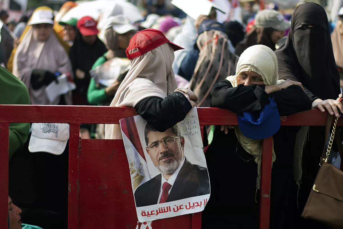 an egyptian woman lean on a barrier as thousands of muslim brotherhood members and supporters of ousted president mohamed morsi gather in front of rabaa al adawiya mosque in cairo photo afp an egyptian woman lean on a barrier as thousands of muslim brotherhood members and supporters of ousted president mohamed morsi gather in front of rabaa al adawiya mosque in cairo photo afp
