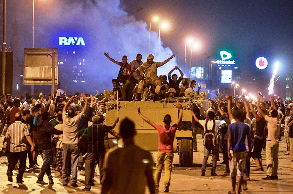 protesters cheer upon the arrival of the egyptian security forces during clashes between ousted president mohammed morsi supporters and anti morsi protesters near egypt 039 s landmark tahrir square on july 5 2013 in cairo egypt photo afp file protesters cheer upon the arrival of the egyptian security forces during clashes between ousted president mohammed morsi supporters and anti morsi protesters near egypt 039 s landmark tahrir square on july 5 2013 in cairo egypt photo afp file