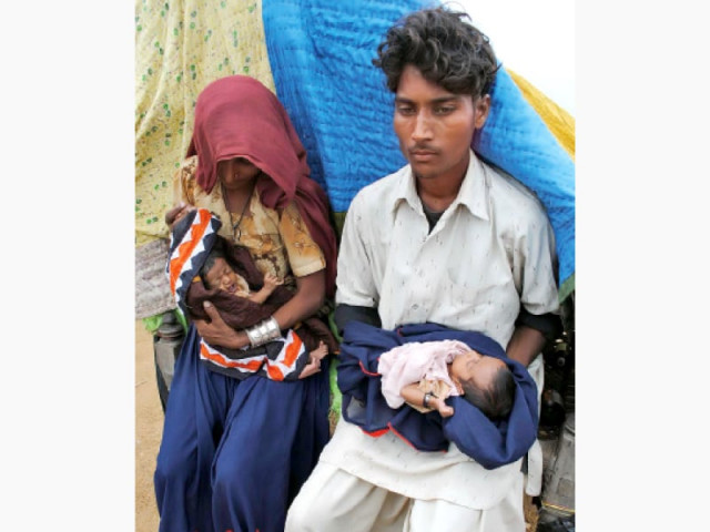 this file photo shows a young couple with their two kids in tando allah yar speakers at a seminar on adolescent pregnancy said that pakistan should introduce laws which ban marriage between individuals under the age of 18 years this file photo shows a young couple with their two kids in tando allah yar speakers at a seminar on adolescent pregnancy said that pakistan should introduce laws which ban marriage between individuals under the age of 18 years
