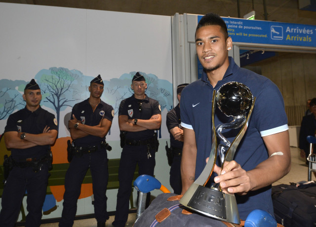under 20 french team goalkeeper alphonse areola poses with the trophy while arriving with his teammates at the roissy charles de gaulle airport on july 14 2013 a day after defeating uruguay during their fifa under 20 world cup final football match in istanbul photo afp under 20 french team goalkeeper alphonse areola poses with the trophy while arriving with his teammates at the roissy charles de gaulle airport on july 14 2013 a day after defeating uruguay during their fifa under 20 world cup final football match in istanbul photo afp