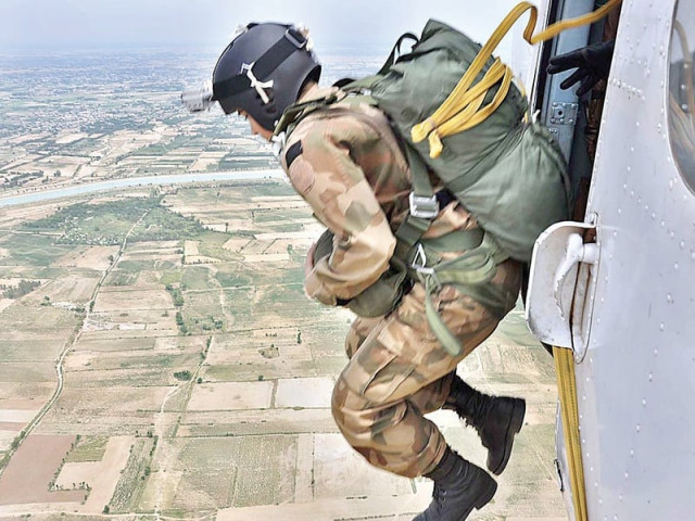 a paratrooper jumps from an mi 17 helicopter after completing the first ever lady officers para training course photo app