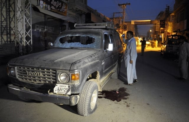 a pakistani plainclothes police officer looks at a bullet riddled vehicle after an attack by gunmen in quetta on july 15 2013 photo afp a pakistani plainclothes police officer looks at a bullet riddled vehicle after an attack by gunmen in quetta on july 15 2013 photo afp