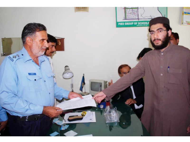 haroon rashid son of the late ghazi abdul rashid submitting his application to register a murder case against former president pervez musharraf photo inp