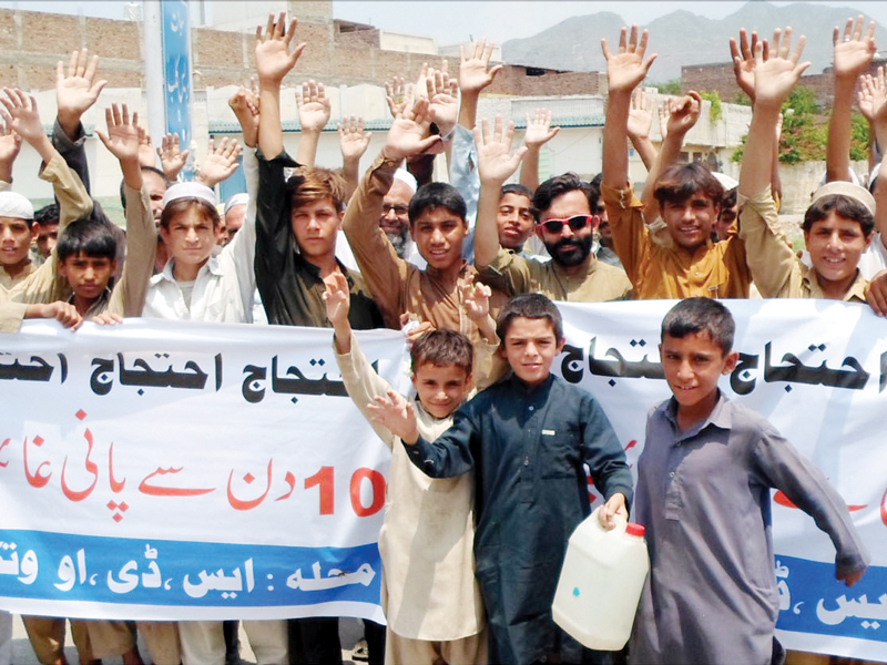 residents of shahdara protest against power and water shortages outside the swat press club photo express