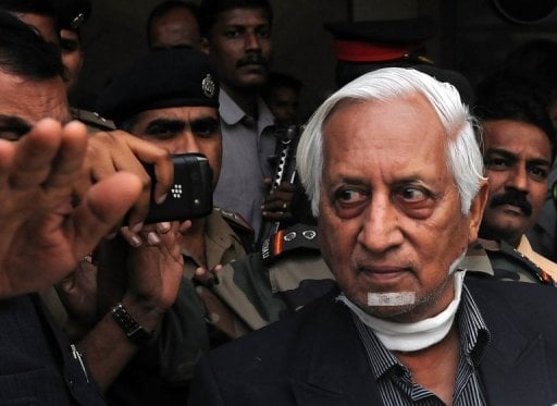 retired indian lieutenant general kuldip singh brar r is escorted out of the chattrapati shivaji international airport after his arrival from london in mumbai on october 3 2012 photo afp