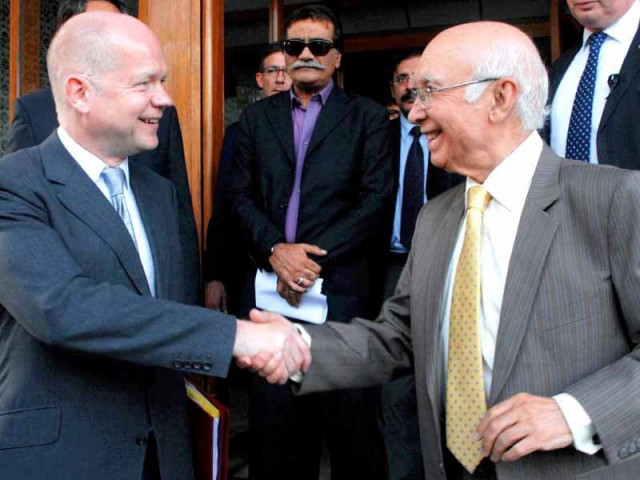 adviser to pm on foreign affairs sartaj aziz and british foreign secretary william hague shake hands after their joint news conference photo online adviser to pm on foreign affairs sartaj aziz and british foreign secretary william hague shake hands after their joint news conference photo online