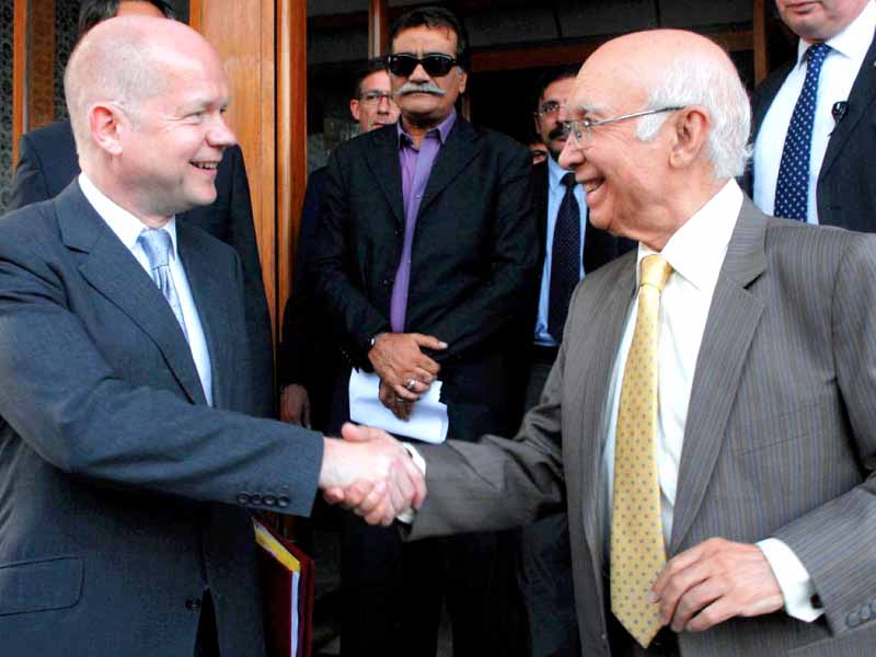 adviser to pm on foreign affairs sartaj aziz and british foreign secretary william hague shake hands after their joint news conference photo online