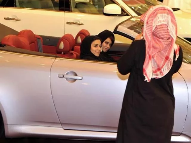 a saudi man takes a picture of two women sitting in a car at an auto show in jeddah photo afp a saudi man takes a picture of two women sitting in a car at an auto show in jeddah photo afp