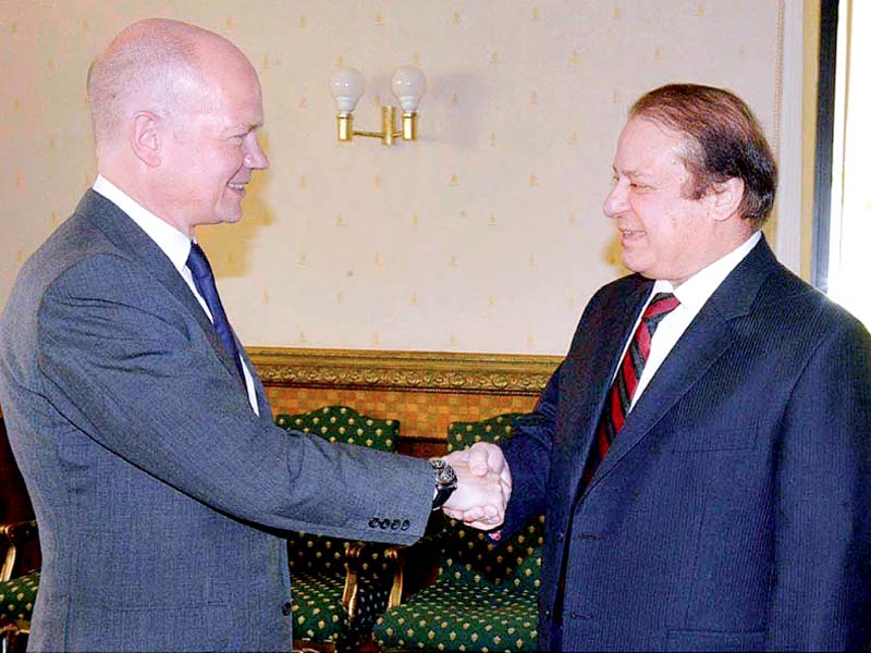 prime minister nawaz sharif and british foreign secretory william hague exchange pleasantries during their meeting at the prime minister s office photo app