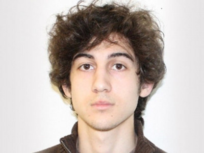 policeman releases manhunt photos of accused boston bomber