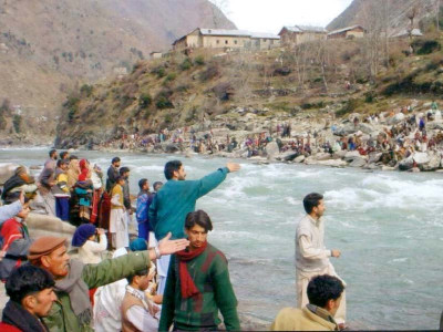kashmir shedding barriers by the riverside