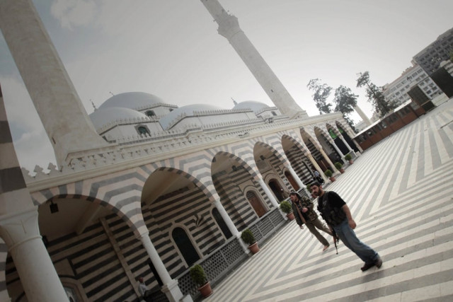 a picture taken on may 3 2012 shows free syrian army militants standing in the courtyard of the khaled ibn al walid mosque in the al khalidiyah neighbourhood of the central syrian city of homs quot activists from the khaldiyeh neighbourhood in the city of homs have reported the destruction by army shelling of the mausoleum of the prophet 039 s companion khaled bin walid quot said the syrian observatory for human rights photo afp a picture taken on may 3 2012 shows free syrian army militants standing in the courtyard of the khaled ibn al walid mosque in the al khalidiyah neighbourhood of the central syrian city of homs quot activists from the khaldiyeh neighbourhood in the city of homs have reported the destruction by army shelling of the mausoleum of the prophet 039 s companion khaled bin walid quot said the syrian observatory for human rights photo afp