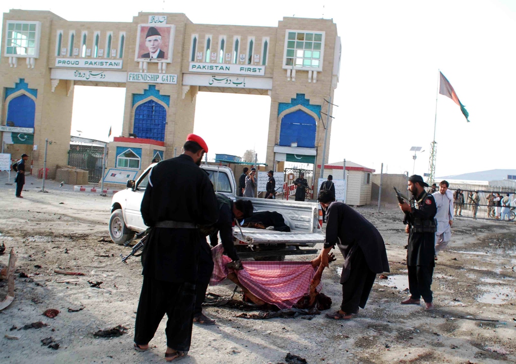 pakistani security personnel remove the body of a blast victim after a bomb explosion at the border town of chaman on july 11 2013 photo afp file