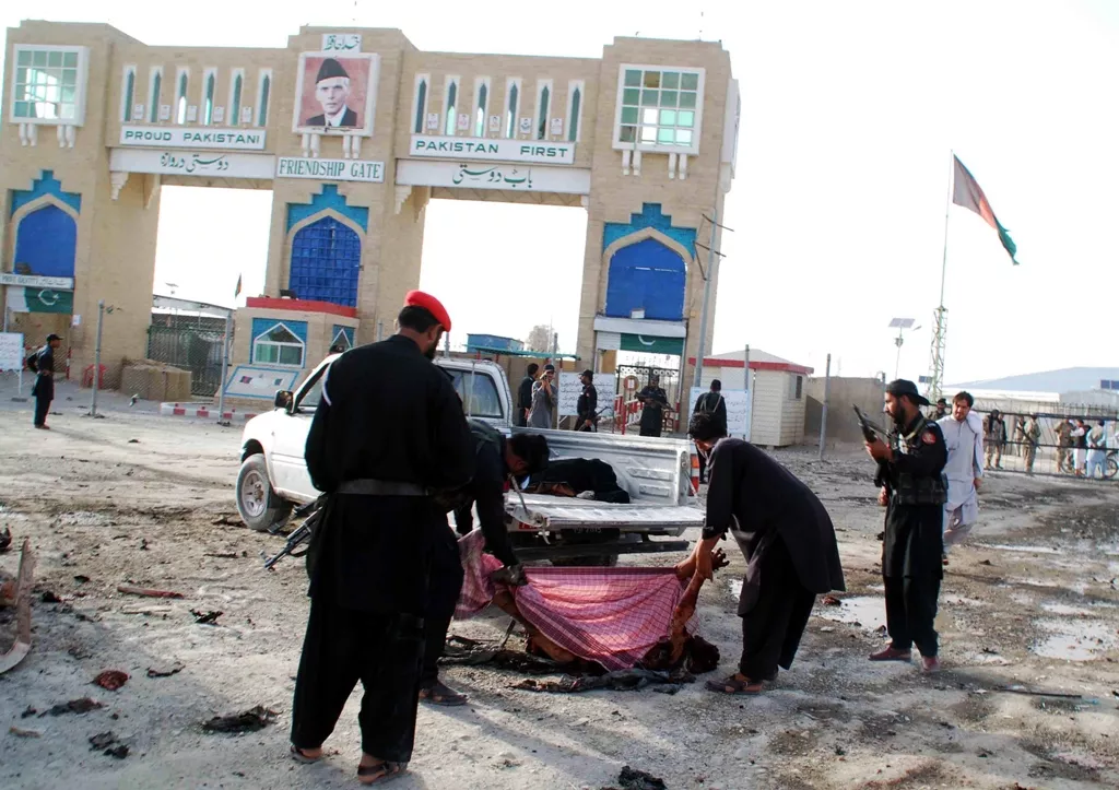 pakistani security personnel remove the body of a blast victim after a bomb explosion at the border town of chaman on july 11 2013 photo afp file pakistani security personnel remove the body of a blast victim after a bomb explosion at the border town of chaman on july 11 2013 photo afp file