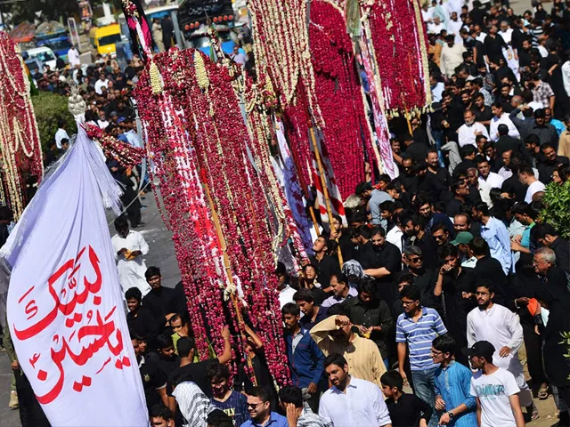 mourners hold religious flags as they march in a procession on muharram 8 in karachi photo afp mourners hold religious flags as they march in a procession on muharram 8 in karachi photo afp