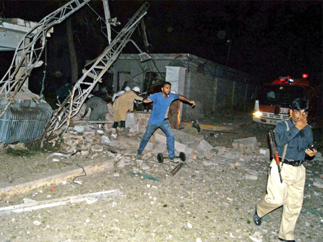 policemen and rescuers at the site of suicide attack in sukkur photo afp policemen and rescuers at the site of suicide attack in sukkur photo afp