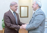 prime minister shehbaz sharif shakes hands with iran ambassador to pakistan dr reza amiri moghadam during a meeting in islamabad photo online