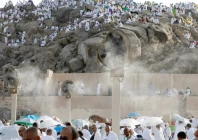 pilgrims gather near misting fans at mount of mercy on the plain of arafat photo reuters