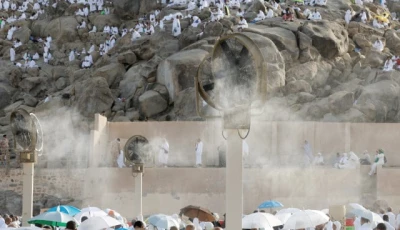 pilgrims gather near misting fans at mount of mercy on the plain of arafat photo reuters