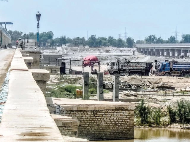 modern bridge the ongoing rehabilitation of the sukkur barrage has reached a significant milestone with successfully replacement of gates the extensive project is transforming the site characterised by bustling construction activity under a bright sunny sky photo ppi modern bridge the ongoing rehabilitation of the sukkur barrage has reached a significant milestone with successfully replacement of gates the extensive project is transforming the site characterised by bustling construction activity under a bright sunny sky photo ppi