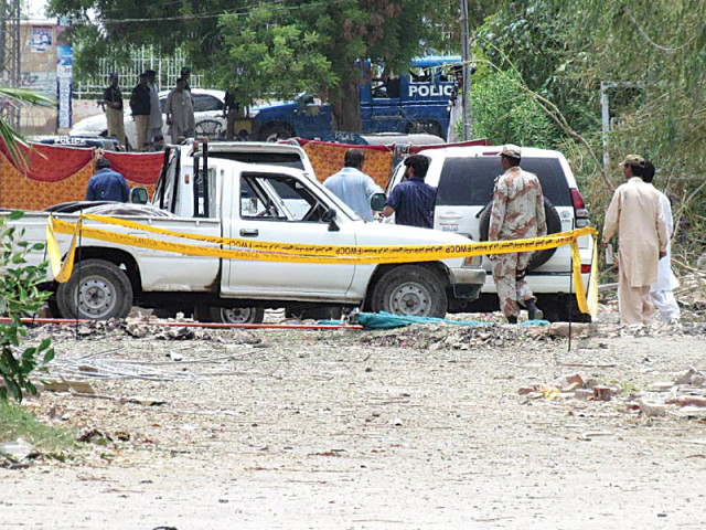 security force personnel examine the site of the suicide bomb blast at the isi complex in barrage colony photo online security force personnel examine the site of the suicide bomb blast at the isi complex in barrage colony photo online