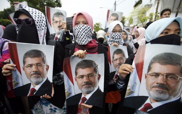 members of the muslim brotherhood and supporters of ousted egyptian president mohamed mursi shout slogans during a rally around rabaa adawiya square where they are camping in cairo july 26 2013 photo reuters members of the muslim brotherhood and supporters of ousted egyptian president mohamed mursi shout slogans during a rally around rabaa adawiya square where they are camping in cairo july 26 2013 photo reuters