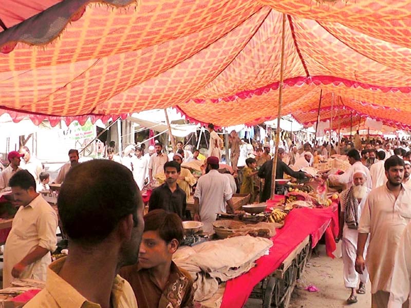 stallholders and customers at the attock sasta bazaar photo rashid ali express