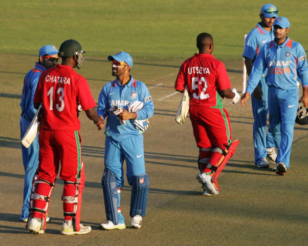 victorious indian players shake hands with zimbabwe 039 s player after winning the second odi photo afp