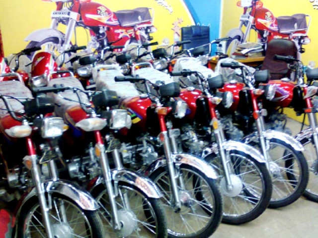 a row of motorcycles at a local dealership photo express a row of motorcycles at a local dealership photo express