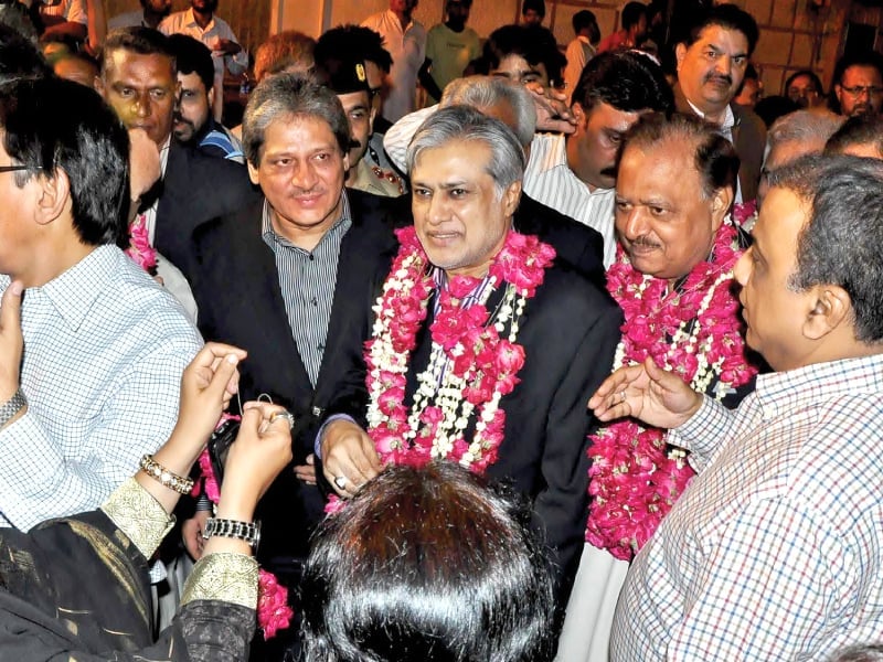 ishaq dar and mamnoon hussain are welcomed with garlands at the mqm headquarters in karachi photo express