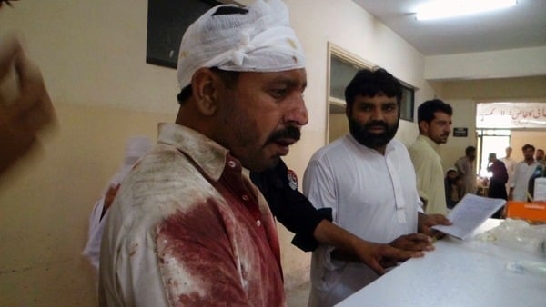 a man who was injured in a blast stands at a hospital in parachinar photo reuters