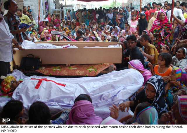 relatives of the men in faisalabad who died after drinking poisonous liquor gather around their caskets photo inp relatives of the men in faisalabad who died after drinking poisonous liquor gather around their caskets photo inp