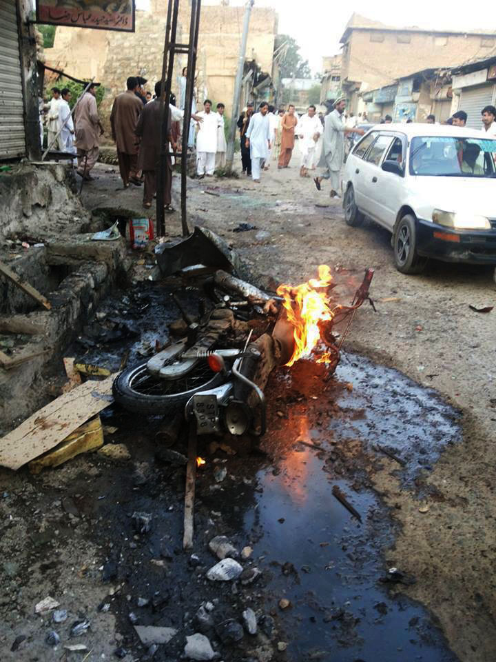 people gather around one of the blast sites in parachinar on friday photo express