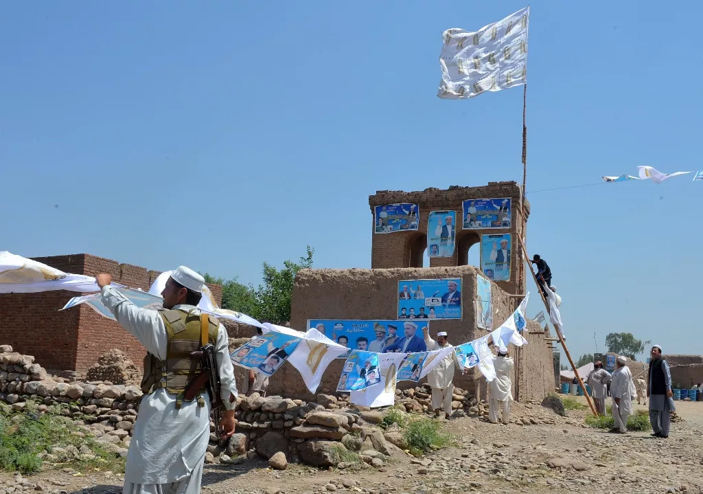 file photo shows party activists in jamrud putting up posters ahead of the may 11 general elections photo afp file file photo shows party activists in jamrud putting up posters ahead of the may 11 general elections photo afp file