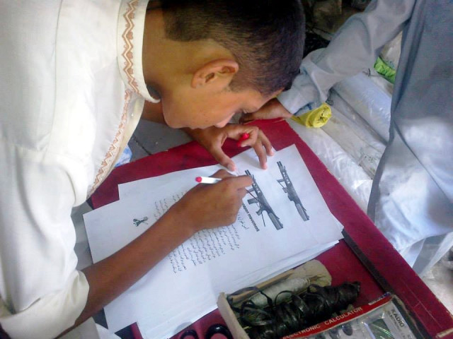 a student with one of the pamphlets distributed during the campaign photo fazal khaliq a student with one of the pamphlets distributed during the campaign photo fazal khaliq